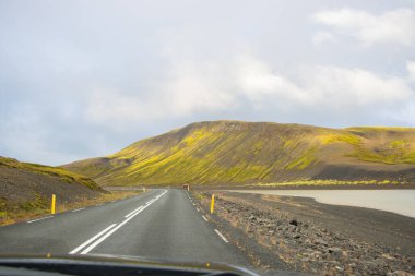 Beautiful Reflection of Houses, Church, Highway and Rainbow Road in Seydisfjordur Town in Iceland