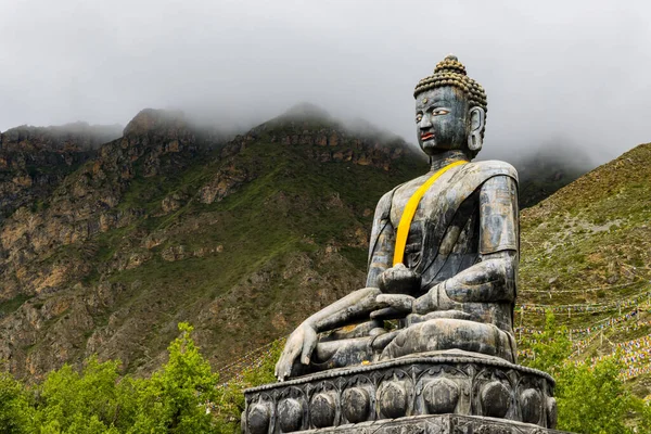 stock image Statue of Siddhartha Gautam Buddha overlooking the Muktinath Village in Upper Mustang, Nepal
