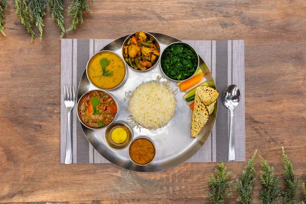 stock image Nepali Meal of Daal Bhaat Tarkari Thakali Thali  Meat Rice vegetables and pickle dhido meal dinner or lunch