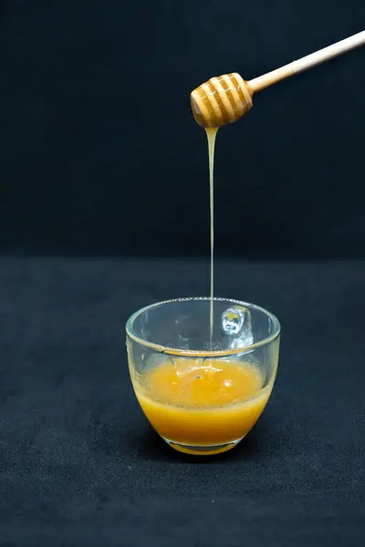 stock image Raw pure Honey from the mountains cliff of Nepal Himalayas Organic Honey Dripping in plate