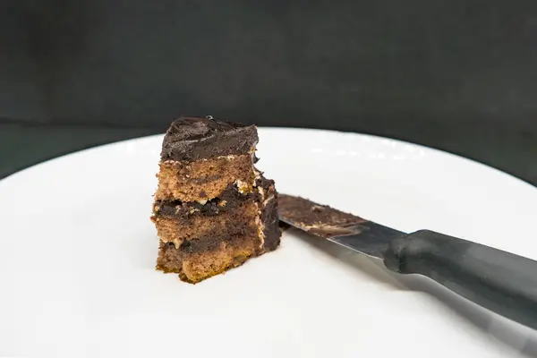 stock image Slice of a Dark Chocolate Truffle Dark Forest Brown Cake for a New Year Celebration