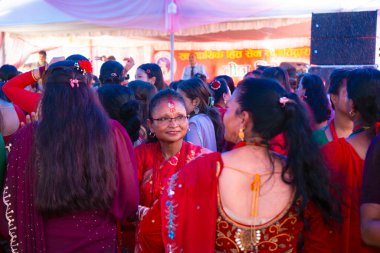 Kathmandu, Nepal - September 06, 2024 : Nepali Hindu Festival Teej Celebration with Women wearing Red Dancing at Pashupatinath Temple in Kathmandu Nepal. Teej is a festival dedicated for Lord Shiva  clipart