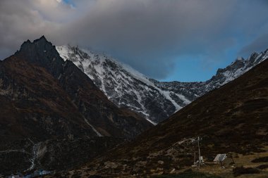 Early Morning Clouds over langtang lirung mountain in the Himalayas of Nepal enroute Tsergo Ri clipart