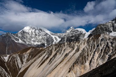 Early Morning Clouds over langtang lirung mountain in the Himalayas of Nepal enroute Tsergo Ri clipart