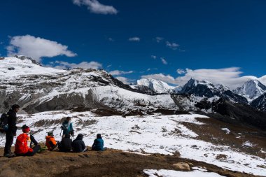 Tsergo Ri, Kyanjin, Langtang, Nepal - October 17, 2024 : Trekkers Hiking the route of Langtang Valley in Tsergo Ri with Himalayan Views of Gangchempo, Langtang Lirung, Yala Peak etc. clipart