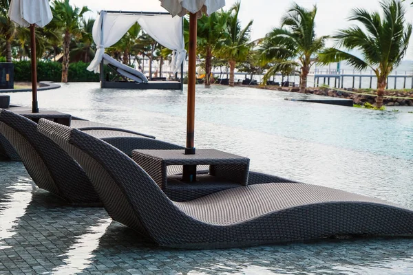 Image of Chaise longue at the pool in tropical resort