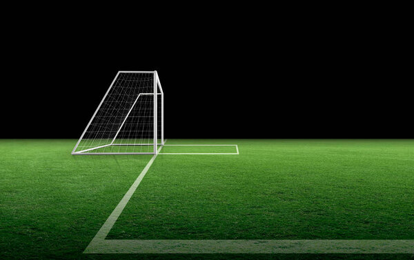 Soccer goal post and soccer net on green grass