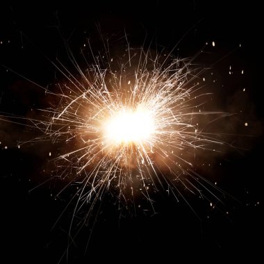 Sparks with smoke on black background