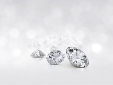 still with expensive cut diamonds in front of a white background, reflections on the ground. Lot of copy space