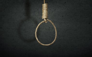 İntihar konsepti. Karanlık duvar arkaplanında gölgesi olan ilmik