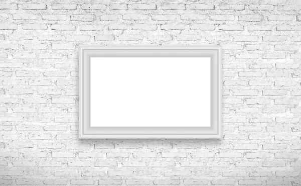 砖的墙上挂着的白色框架 — 图库照片