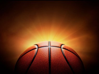 basketball ball. on black background with smoke, yellow orange red white colored back lights