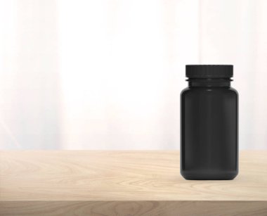 Tahta masadaki ilaç için siyah takviye şişesi.