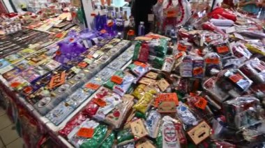 Budapest, Hungary, August 2022. Footage pan on the spice counter in the central market. The movement explores the many packs of the many spices on offer.