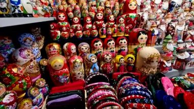 Budapest, Hungary, August 2022. At the central market pan footage on the counter of wooden dolls typical of the place. Pan movement