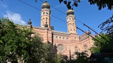 Budapest, Hungary, August 2022. Slow motion tilt footage of the synagogue, the largest in Europe. Beautiful summer day.