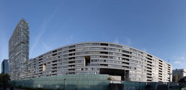 Vienna, Austria, August 23, 2022. Panoramic shot of the Mischek Tower in the modern part of the city, the Donau. It is characterized by the large horizontal development of the condominium complex. clipart