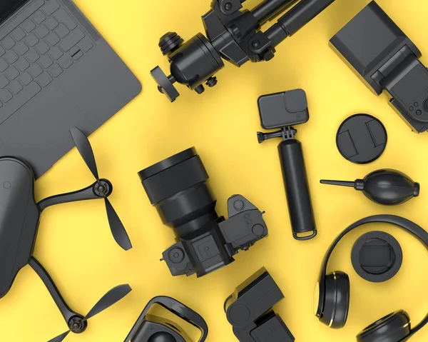 Top view of monochrome designer workspace and gear like nonexistent DSLR , lens, drone, tripod and action camera on yellow background. 3d render of accessories for drawing and photography tools