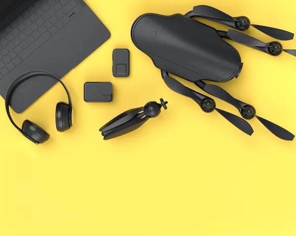 Top view of monochrome designer workspace and gear like laptop, headphones, drone, tripod and action camera on yellow background. 3d render of accessories for drawing, sketching and photography tools