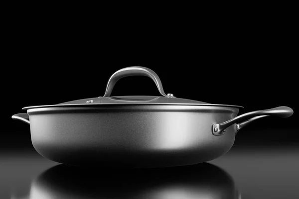 Stainless steel frying pan with glass lid and chrome plated aluminum cookware on black background. 3d render of non-stick kitchen utensils