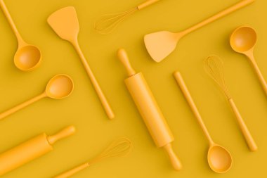 Ahşap mutfak aletleri, aletler ve ekipmanlar sarı monokrom arka planda. Ev yapımı mutfak aletleri ve yemek pişirmek için aksesuarlar