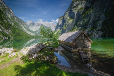 View of Bootshaus am Obersee lake in Berchtesgaden National Park, Upper Bavarian Alps, Germany, Europe. Beauty of nature concept background. clipart