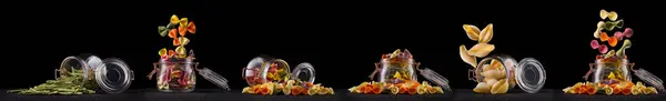 stock image Jar of different type of pasta isolated on black background.