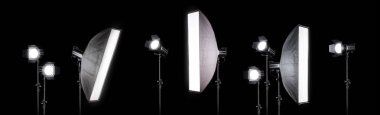 Photography studio flash on a lighting stand isolated on black background with copy space. Professional equipment like monobloc clipart