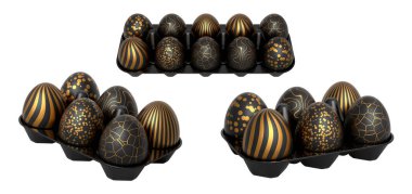 Tepsilerde altın desenli, beyaz şeffaf arka planda izole siyah yumurtalar. Lüks, zarafet ve bolluk kavramı.