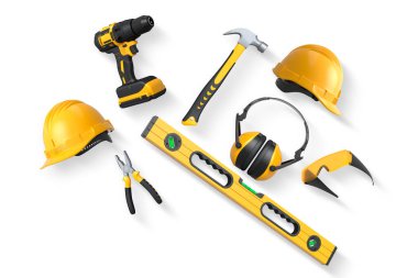 Yapım araçları ve güvenlik ekipmanları kesme yolu olan beyaz arka planda izole edilmiş. İş güvenliği ve inşaat araçları kavramı