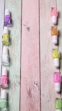 Bunch of nail polish bottles, colors of enamel, copy space