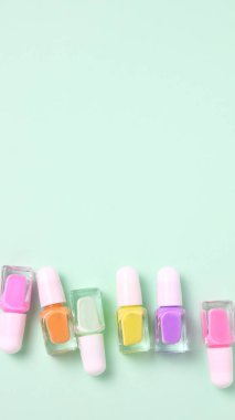Nail polish variety, colorful enamel bottles, copy space