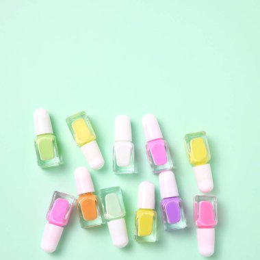 Nail polish variety, colorful enamel bottles, copy space
