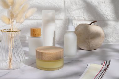 Cosmetic bottles on table, lifestyle, mockup