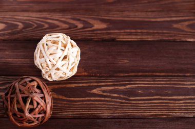  Wooden dried rattan balls on wooden table