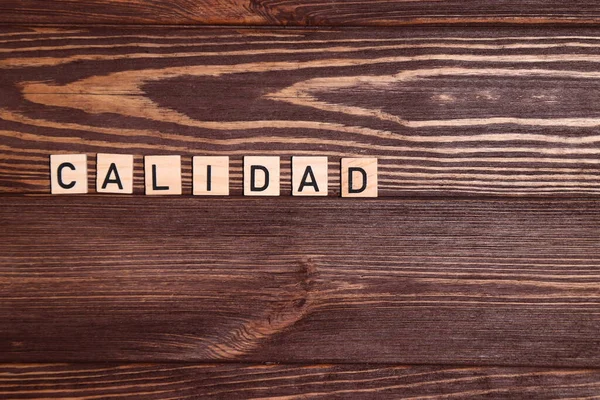 Slovo Calidad Španělské Slovo Kvalita Dřevěném Pozadí — Stock fotografie