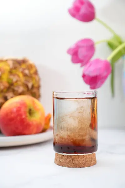 stock image Natural brown supplements liquid vitamins drop in glass of water with pipette, lifestyle