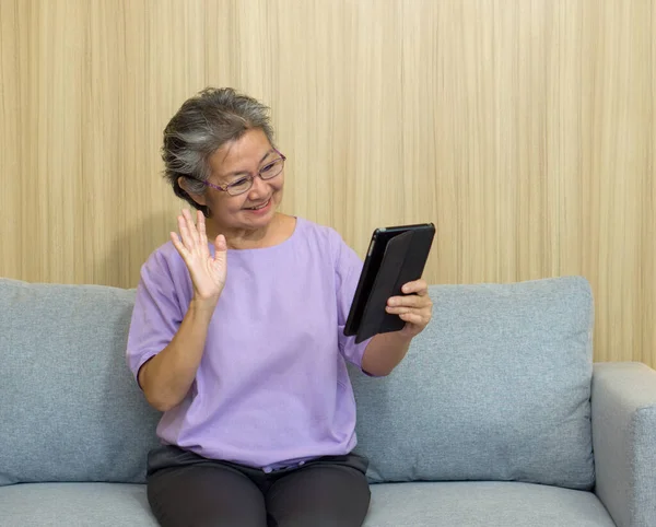 Asian Gray Hair Old Woman Waving Hand Remote Communication Tablet — Stock Photo, Image