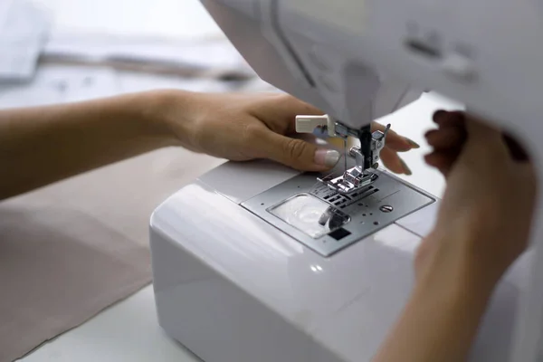 stock image Fashion designer room, The tailor is checking the authenticity of the sewing machine. Closeup