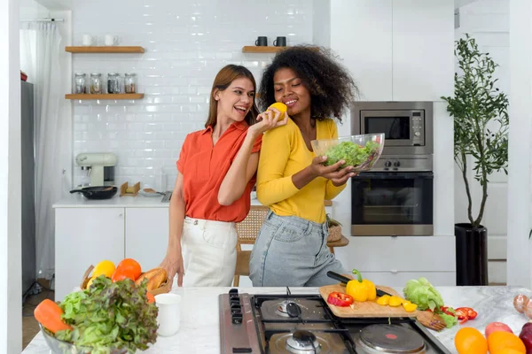 Healthy Lifestyle Choices: Two Females in Kitchen with Organic Harvest