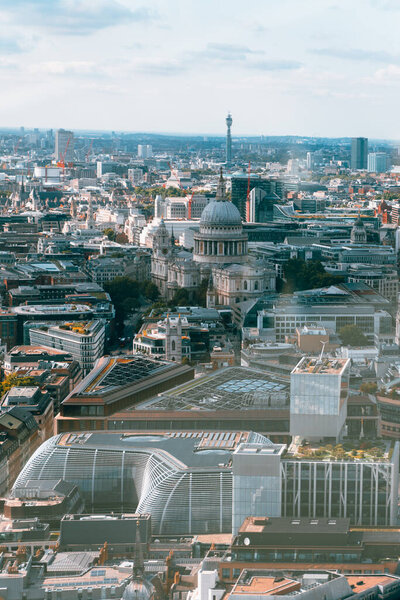 Bird's-eye view of a bustling cityscape with iconic skyscrapers and architectural landmarks in London