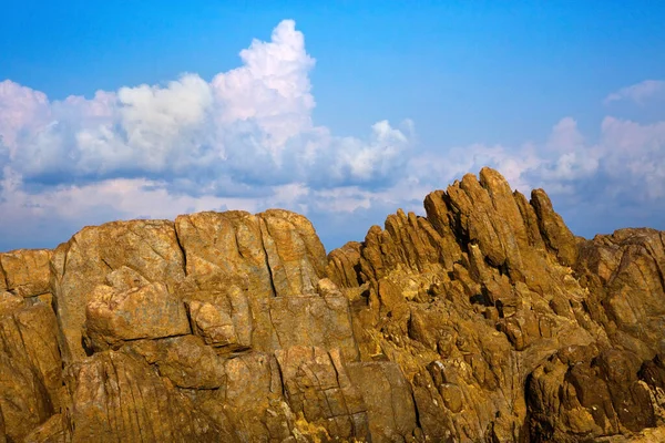 stock image Rocks and sky with beautiful clouds.