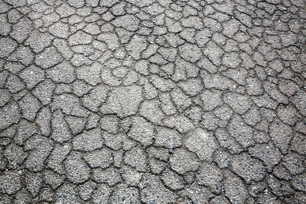 stock image Cracked pattern of paved road for background.