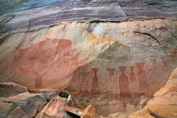 Prehistoric color painting on the rock cliff at Pha Taem National Park, a geological attraction of Ubon Ratchathani Province, Thailand.