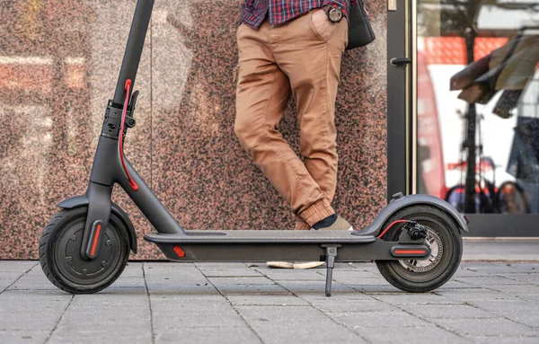 Electric Scooter Parked Tiled Pavement Closeup Detail Man Standing Next — Stock Photo, Image