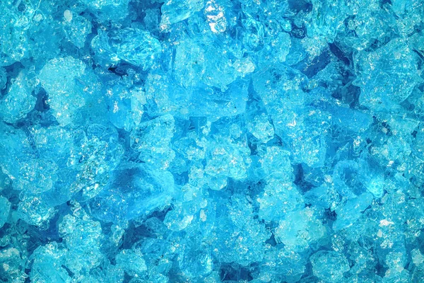 Blue copper sulphate crystals under 4x microscope magnification - image width 8mm