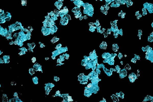 Blue copper sulphate crystals under 4x microscope magnification image width 9mm