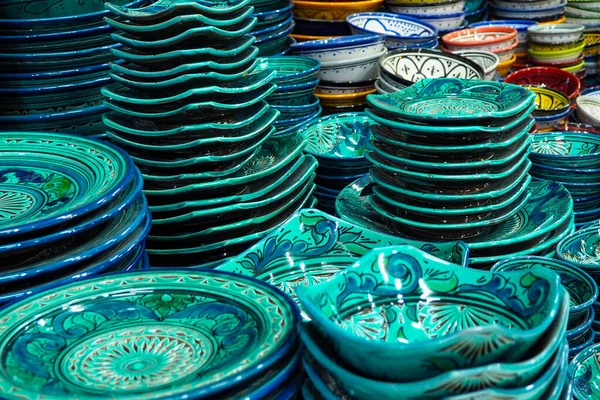 stock image Pile of green and blue coloured plates or cups displayed at market in Morocco