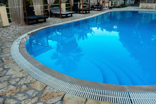 Small swimming pool at holiday resort, closeup detail.