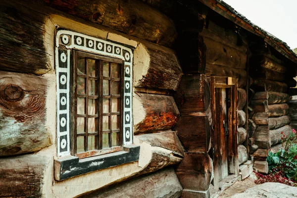 wooden old window in an old country house made of wood